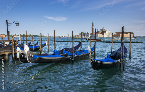 Gondolas in the lagoone at the St Mark's Square in Venice, Italy © Frischschoggi