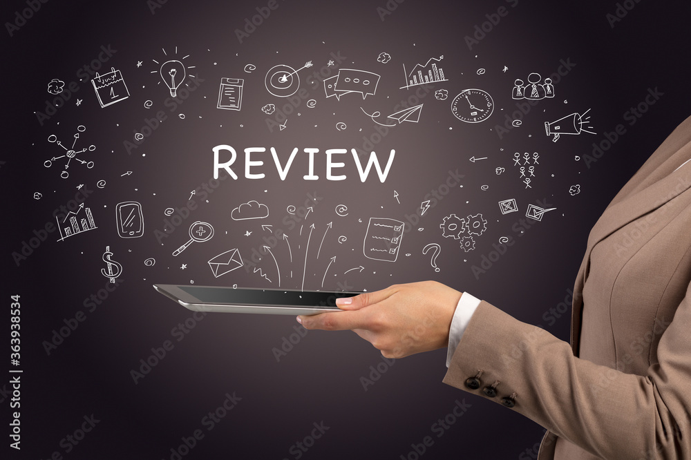 Fototapeta premium Close-up of a touchscreen with REVIEW inscription, social media concept