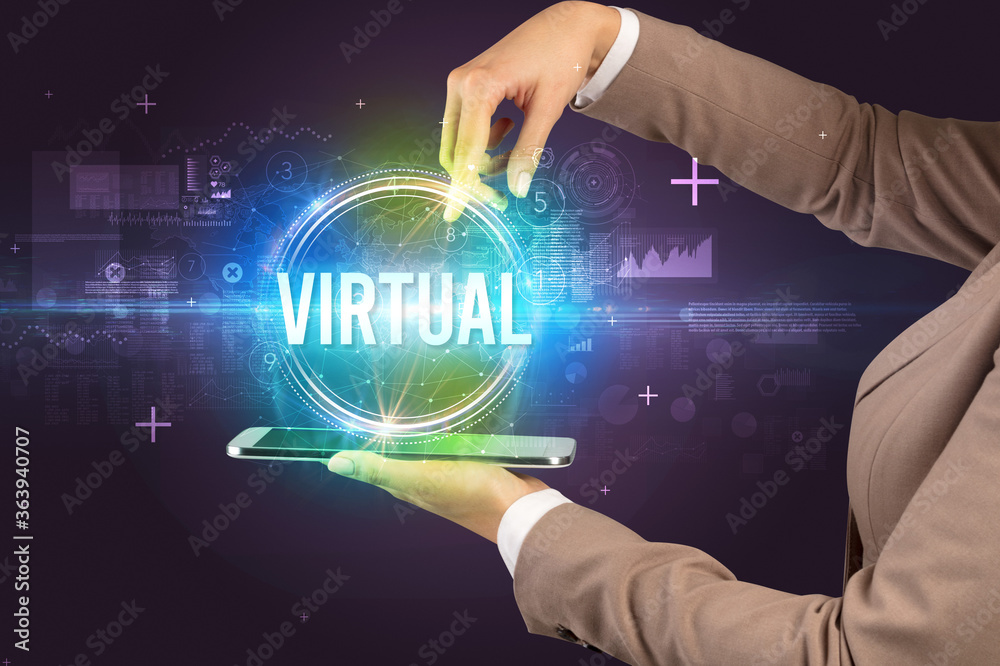 Close-up of a touchscreen with VIRTUAL inscription, new technology concept Close-up of a touchscreen with VIRTUAL inscription, new technology concept