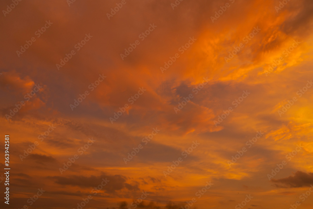 Fototapeta premium unusually beautiful fiery red tropical sunset. Burning clouds. Fire in the sky