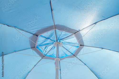 Blue beach umbrella close up