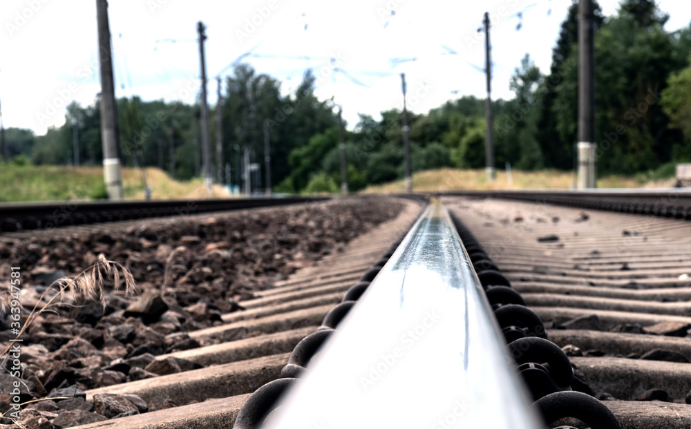 Railway rail running to the skyline. Close-up. Railway rail running to the skyline. Close-up.