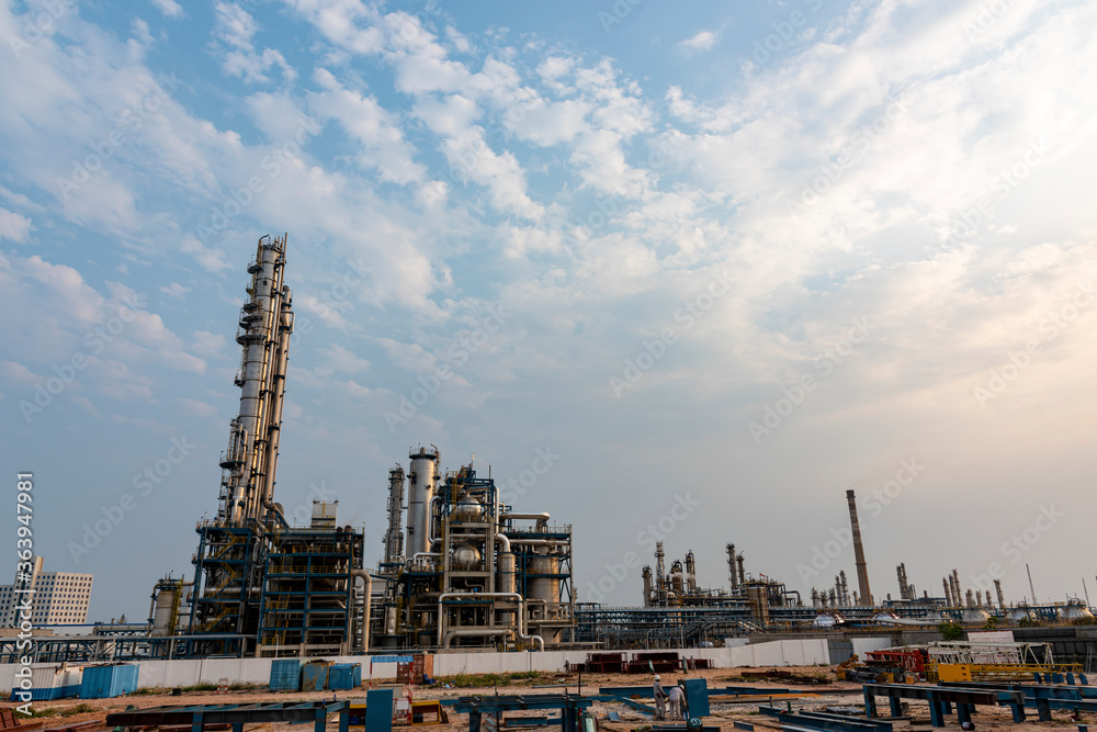 Refinery plant under the background of blue sky white clouds Refinery plant under the background of blue sky white clouds