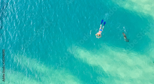 Aerial view of two people enjoying diving at sea.Copy space image.