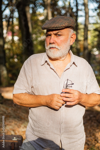 Fototapeta Naklejka Na Ścianę i Meble -  Im not getting older, Im ageing to perfection. Senior person with grey beard hair walk outdoors. Senior man relax in summer nature. Senior care. Pensioner enjoy summer day. Pension and retirement