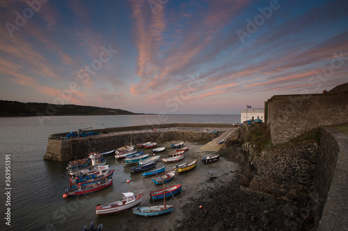 Coverack harbour in Cornwall, UK at Sunset photo