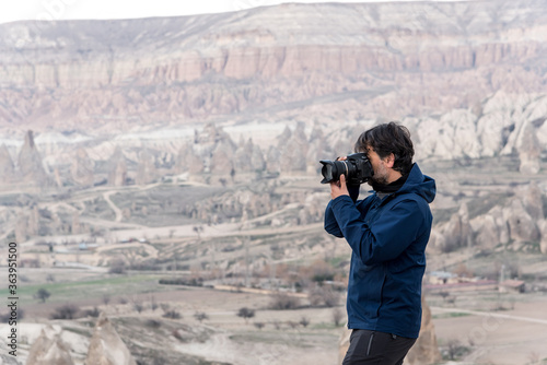 Photographer shooting picturesque hills