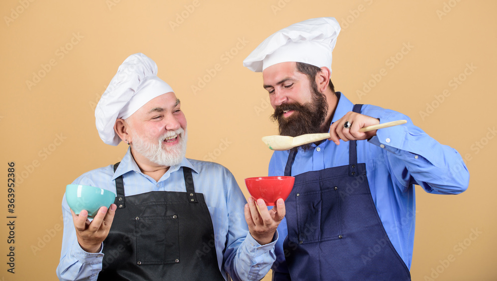 Cooking by recipe. professional restaurant cook. new recipe. Perfect taste. mature senior bearded men in kitchen. taste food. culinary concept. Chef men cooking. cheerful men prepare food Cooking by recipe. professional restaurant cook. new recipe. Perfect taste. mature senior bearded men in kitchen. taste food. culinary concept. Chef men cooking. cheerful men prepare food