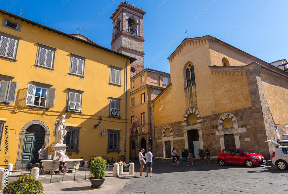 Church of San Salvatore and Fountain Della Pupporona in the Misericordia square of Lucca, Tuscany, Italy