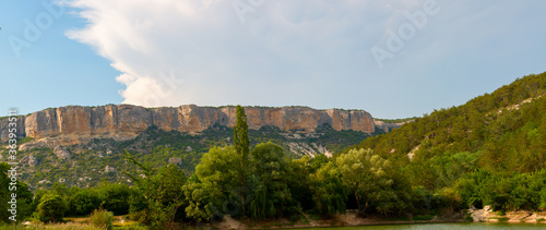 Panorama of a rocky ridge near the mountain Crimean forest.