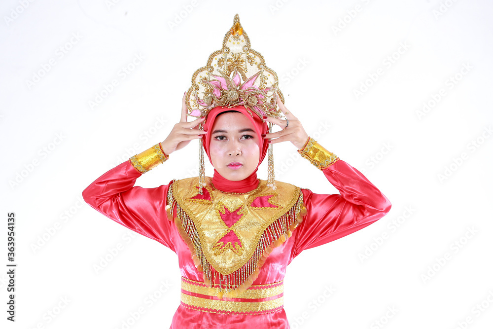 Beautiful smiling Asian girl wearing a set of modern traditional clothes, the traditional female outfits originated from Indonesia. Indonesian Women
