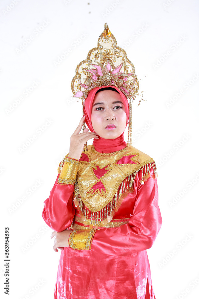 Beautiful smiling Asian girl wearing a set of modern traditional clothes, the traditional female outfits originated from Indonesia. Indonesian Women