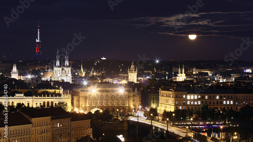 Prague cityscape at full moon night, Czech Republic.