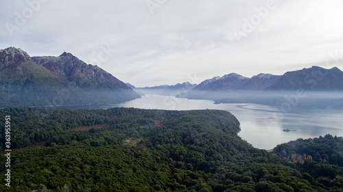 Wilderness. Aerial view of lake Nahuel Huapi  the forest foliage  mist and mountains.