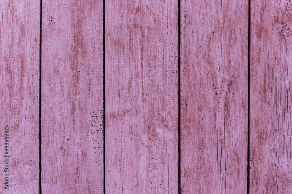 Naklejka premium Rustic wood texture or background with scratched pink paint.