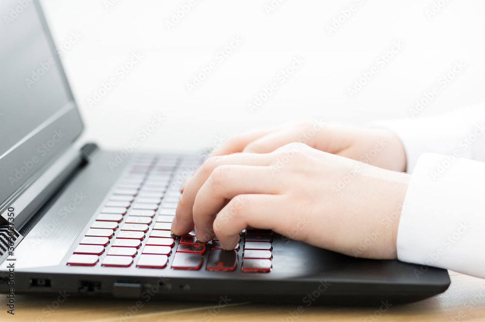 Close-up of hands on laptop keyboard. Online work concept Close-up of hands on laptop keyboard. Online work concept