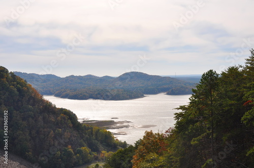 Landscape of a tree lined lake in Autumn with Fall colors