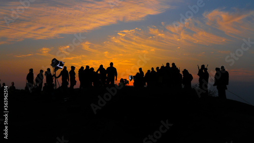 silhouette of people at sunset © Giyos