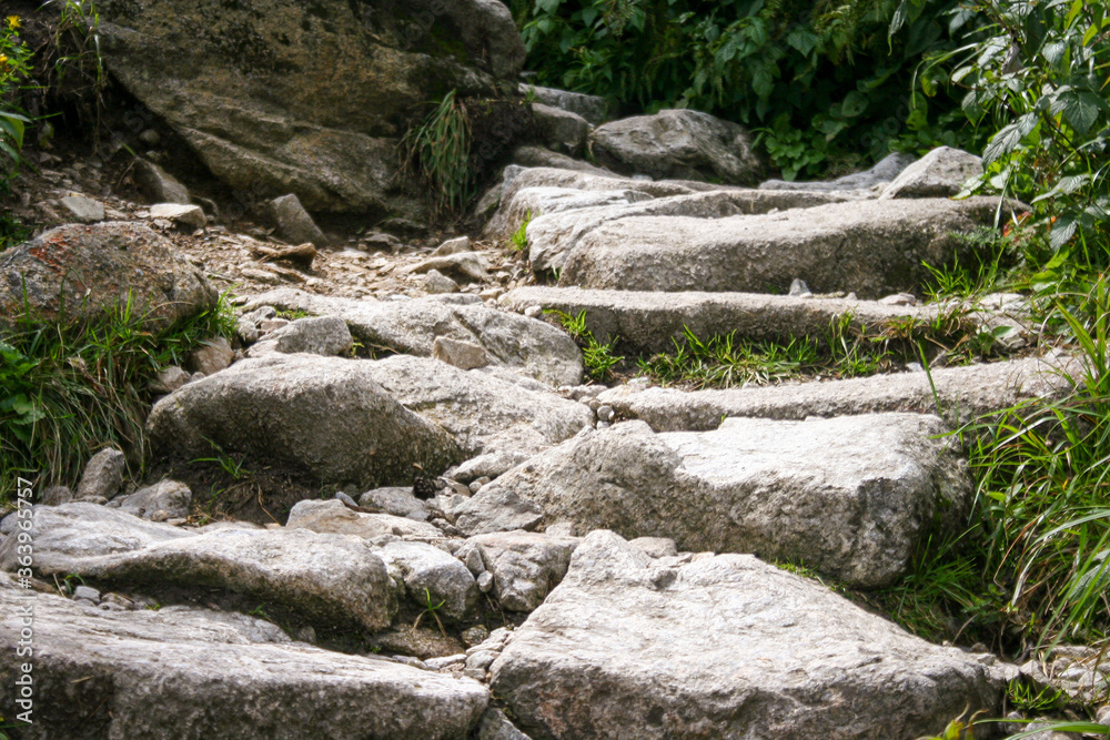 Natural stairs in mountains. Outdoor pathway in Tatra Mountains. Stairs made on stone. Mountains valley. Natural stairs in mountains. Outdoor pathway in Tatra Mountains. Stairs made on stone. Mountains valley.