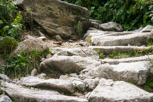 Natural stairs in mountains. Outdoor pathway in Tatra Mountains. Stairs made on stone. Mountains valley. photo