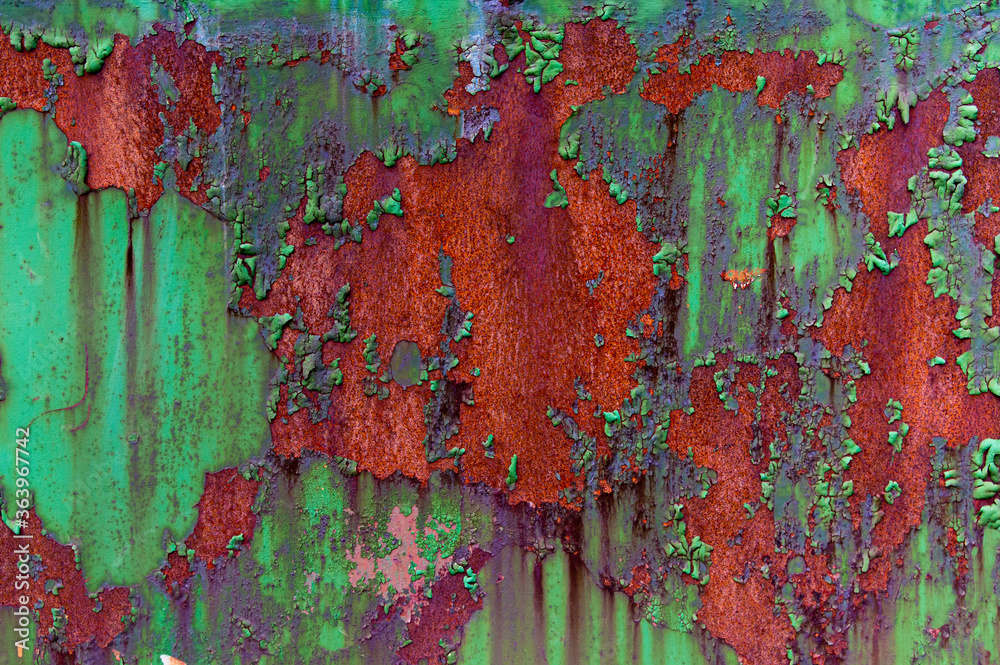 Red green cracked peeling contrast background.