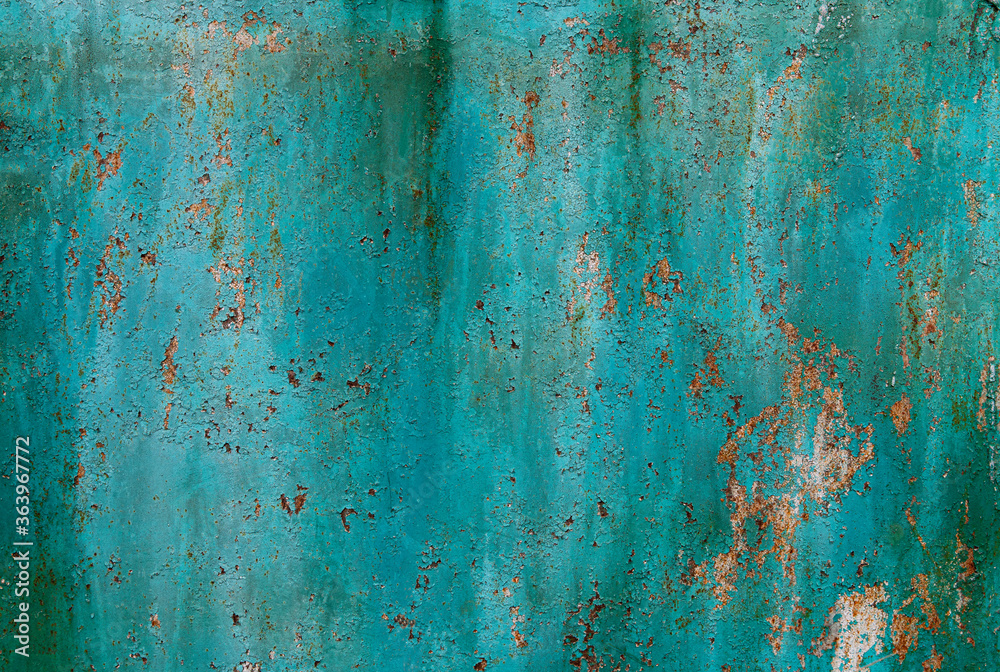 Turquoise cracked peeling rusty background.