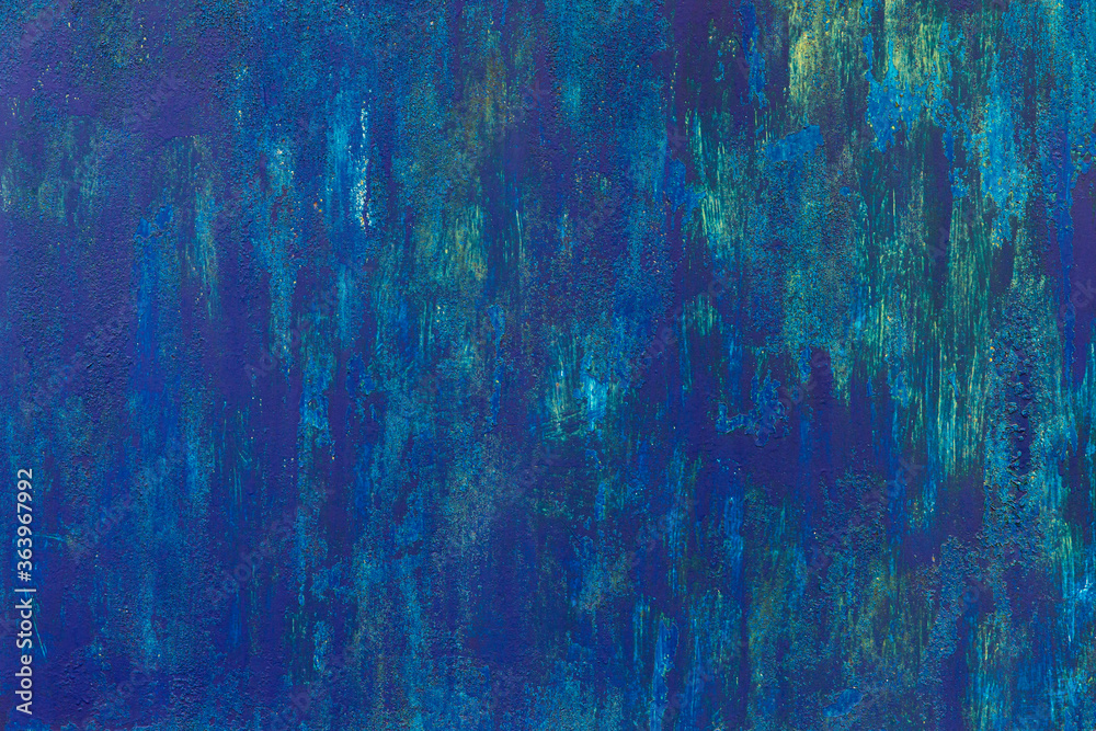 Obraz premium Dark blue patchy weathered uneven painted wall.