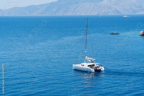 Sailingboat on beautiful, turquoise color, clean sea.
