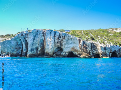Blue Caves on Zakynthos island. Sea and rocks on sunny day in Greece. 