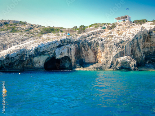 The island of Zakynthos. Blue caves. The Ionian Sea, Greece, flag of Greece