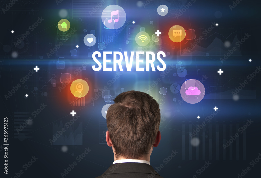 Rear view of a businessman with SERVERS inscription, modern technology concept Rear view of a businessman with SERVERS inscription, modern technology concept