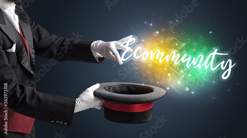 Magician hand conjure with wand and Ecommunity inscription, shopping concept photo