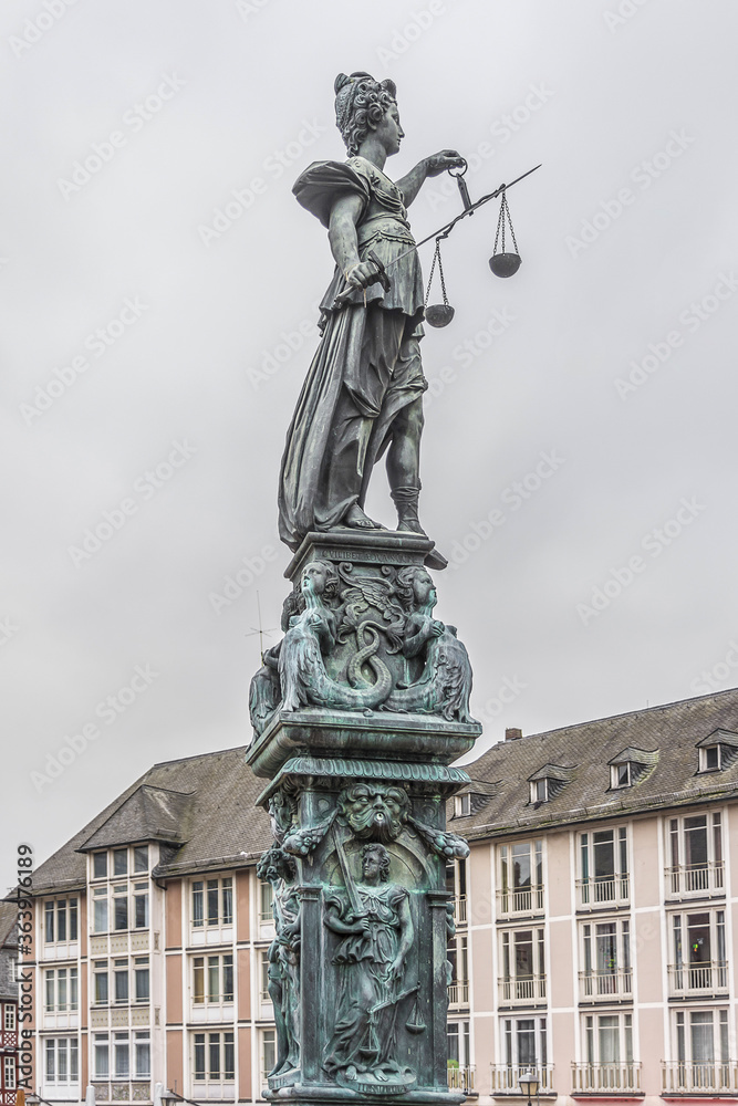 Statue of Lady Justice in front of the Romer at Romerberg (Romerplatz) in Frankfurt am Main, Germany. Statue of Lady Justice in front of the Romer at Romerberg (Romerplatz) in Frankfurt am Main, Germany.