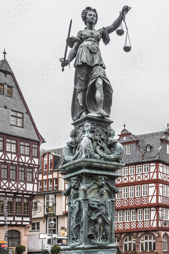 Statue of Lady Justice in front of the Romer at Romerberg (Romerplatz) in Frankfurt am Main, Germany.