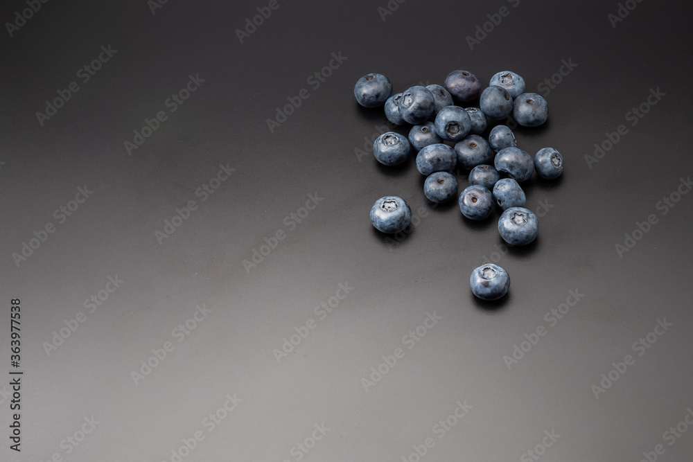 Fresh organic blueberries isolated on black background with copy space for text Fresh organic blueberries isolated on black background with copy space for text