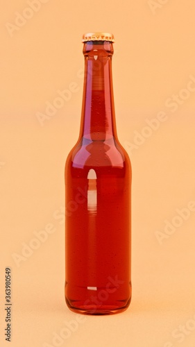 Lager beer bottle with golden cap on orange background. 3D illustration