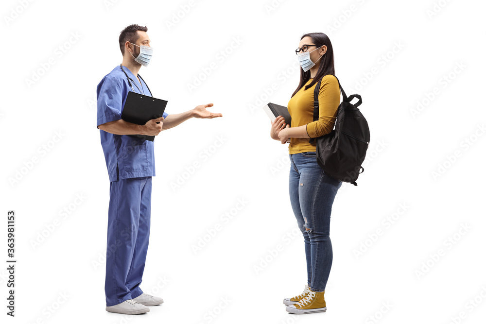 Medical worker with a face mask talking to a female student Medical worker with a face mask talking to a female student