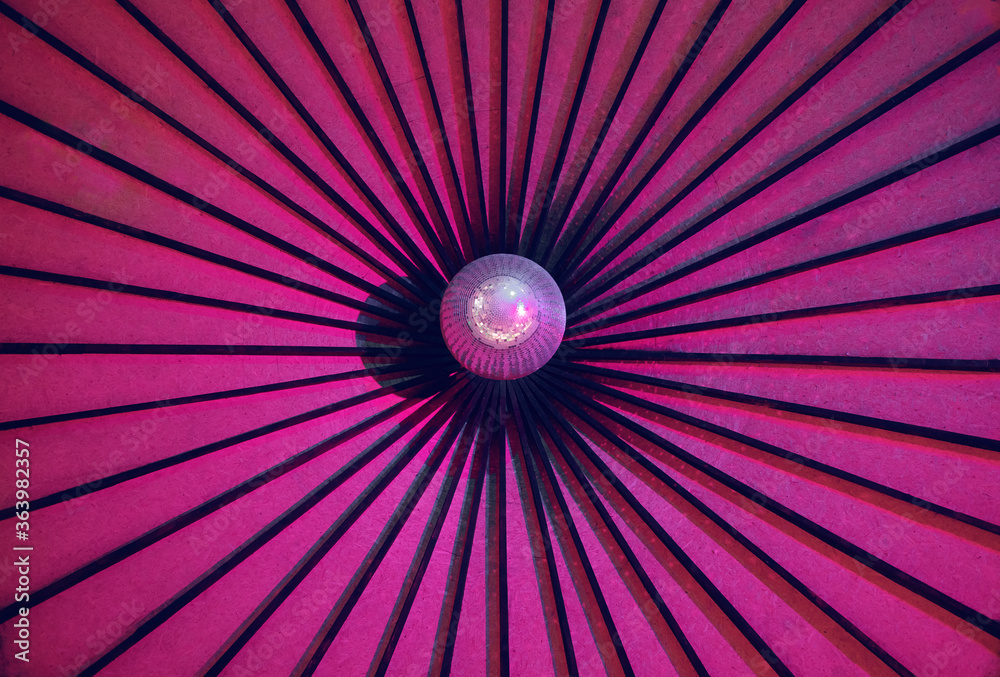 pink background with a mirror ball, night club, place for text, night