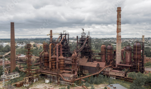 aerial photo of an old abandoned steel plant in the natural landscape