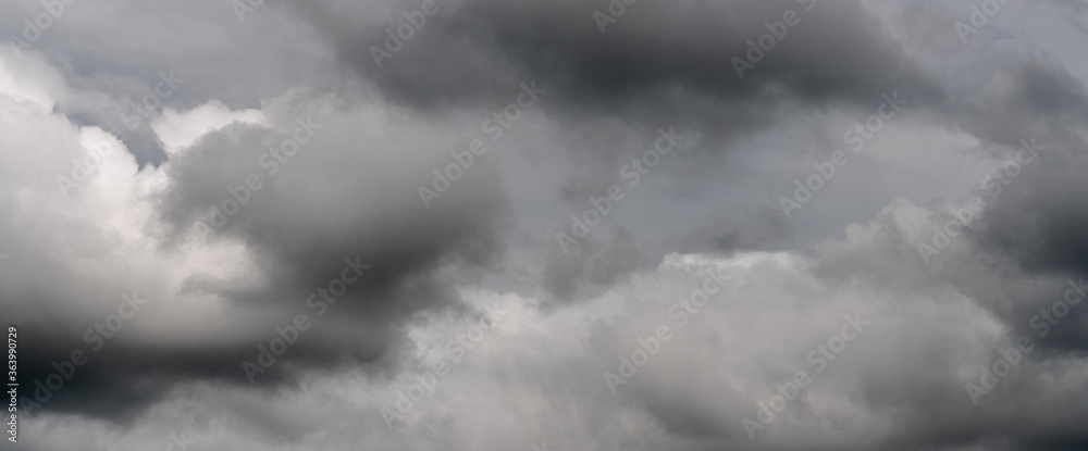 Scenery panoramic view of thunderstorm clouds in dusk sky during rain. Dramatic panorama of natural cloudiness weather background. Soft focus, blurred motion sky landscape. Scenery panoramic view of thunderstorm clouds in dusk sky during rain. Dramatic panorama of natural cloudiness weather background. Soft focus, blurred motion sky landscape.