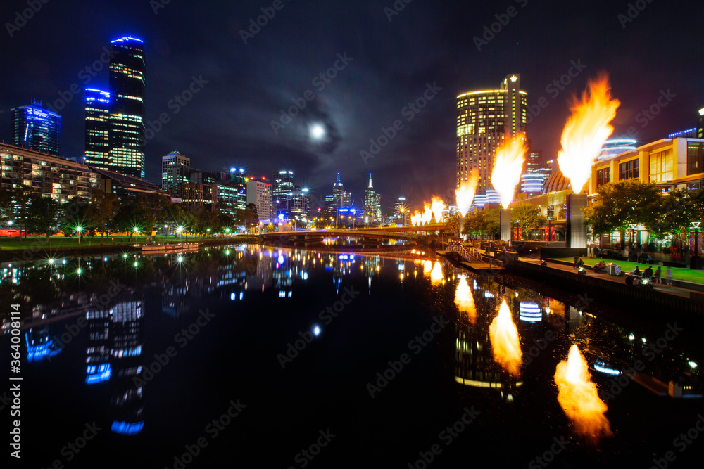 Moonrise over Melbourne city with the Corwn Casino fireballs are at display
