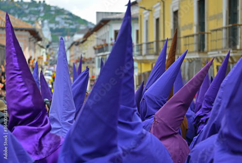 The procession of the cucuruchos in Quito, Ecuador, during Easter. Penitents put a purple robe and walk through the city on Holy Friday. photo