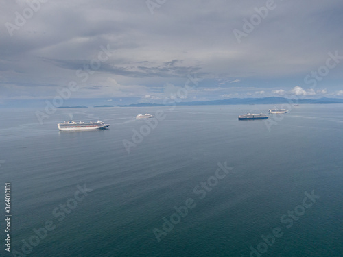 Beautiful aerial view of a lot of Cruise Ships on the middle of the ocean © Gian