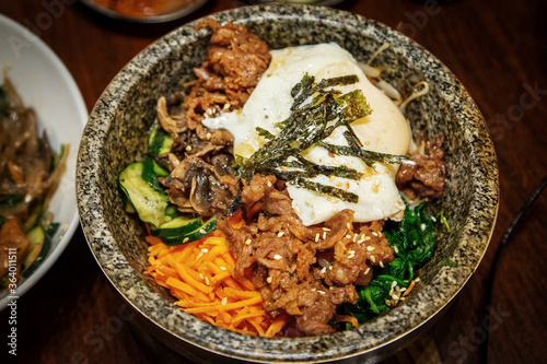 Korean bibimbap dish in traditional hot stone bowl