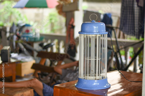Foto electric mosquito trap use home. Mosquito control concept.