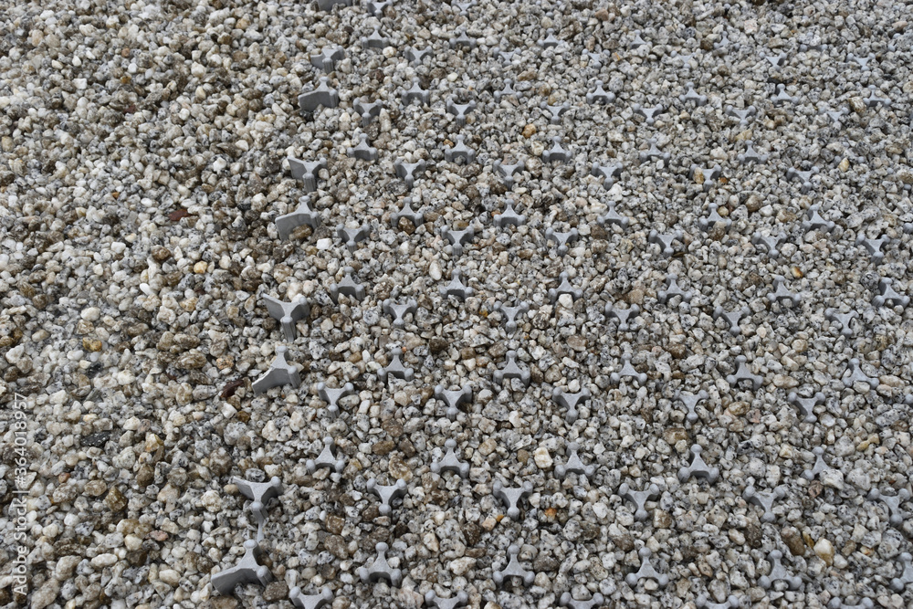 Image of Gravel floor with gravel slip prevention material Image of Gravel floor with gravel slip prevention material