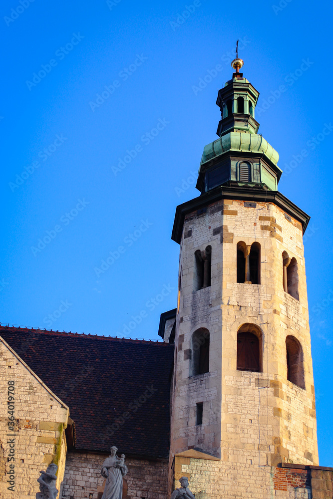 The Roof And Spires Of The Ancient Church Against The Backdrop Of An Almost Cloudless Blue Sky.