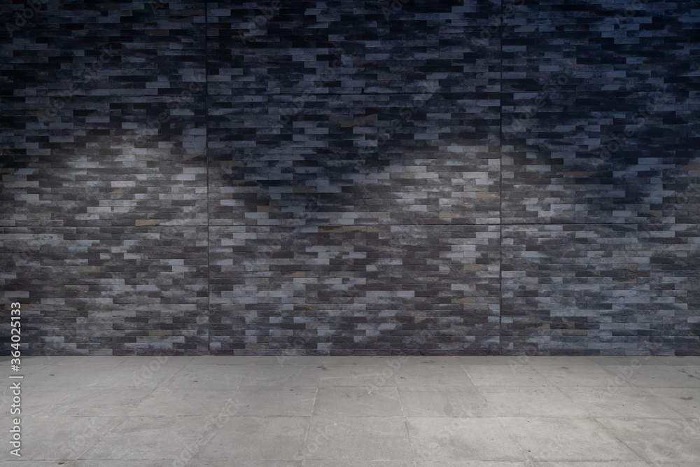 Empty stone pavement and brick wall background