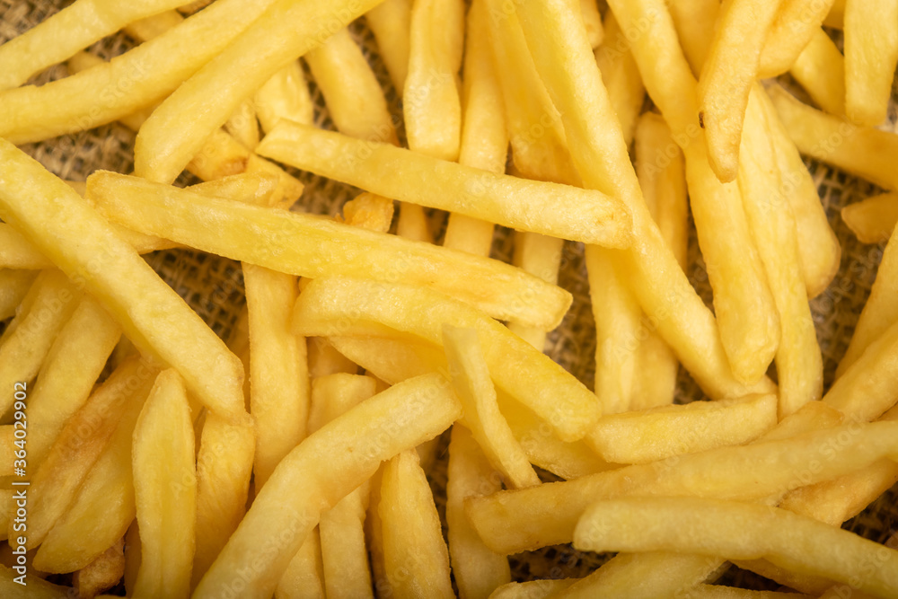French fries scattered surface texture. Close up. French fries scattered surface texture. Close up.