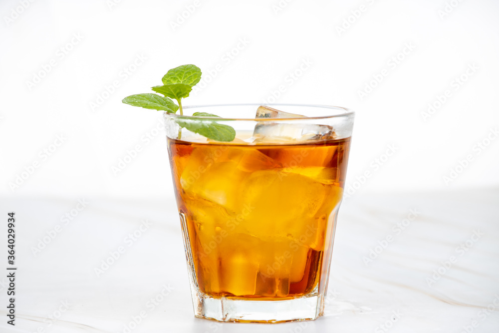 A strong drink with ice and mint A strong drink with ice and mint